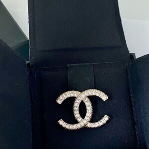Chanel  iconic interlocking CC brooch.